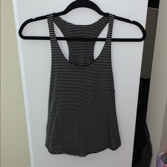 One grey and one black stripped tank tops. - Picture 1 of 2
